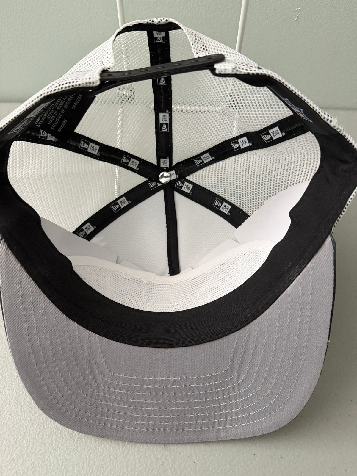 Inside View: Front profile shot of a brand new New Era New York Jets The Golfer snapback hat featuring a green and white sublimated tie dye front panel, premium embroidered white jets logo, gray structured brim, and breathable white mesh trucker backing. 