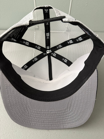 Inside View: Front profile shot of a brand new New Era New York Jets The Golfer snapback hat featuring a green and white sublimated tie dye front panel, premium embroidered white jets logo, gray structured brim, and breathable white mesh trucker backing. 