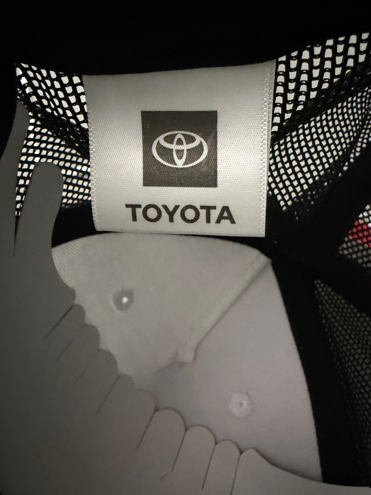 Official Tag: Brand new Toyota Off-Road Racing rope trucker hat in black and white, featuring a large embroidered retro shield logo patch, checkerboard racing stripes, and a braided white rope detail on a snapback cap from Bell's Bargain Barn.
