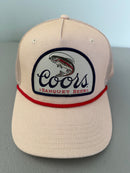Brand new Coors Banquet Beer Fy Fishing mesh trucker hat featuring a cream structured crown, an embroidered oval patch with a rainbow trout graphic, tan mesh panels, a bright red braided front visor rope, and a snapback closure from Bell's Bargain Barn