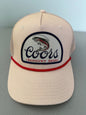 Brand new Coors Banquet Beer Fy Fishing mesh trucker hat featuring a cream structured crown, an embroidered oval patch with a rainbow trout graphic, tan mesh panels, a bright red braided front visor rope, and a snapback closure from Bell's Bargain Barn