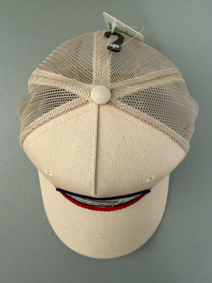 Top View: Brand new Coors Banquet Beer Fy Fishing mesh trucker hat featuring a cream structured crown, an embroidered oval patch with a rainbow trout graphic, tan mesh panels, a bright red braided front visor rope, and a snapback closure from Bell's Bargain Barn