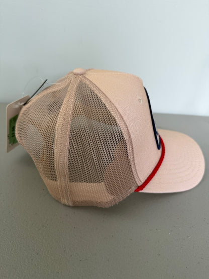 Side View: Brand new Coors Banquet Beer Fy Fishing mesh trucker hat featuring a cream structured crown, an embroidered oval patch with a rainbow trout graphic, tan mesh panels, a bright red braided front visor rope, and a snapback closure from Bell's Bargain Barn