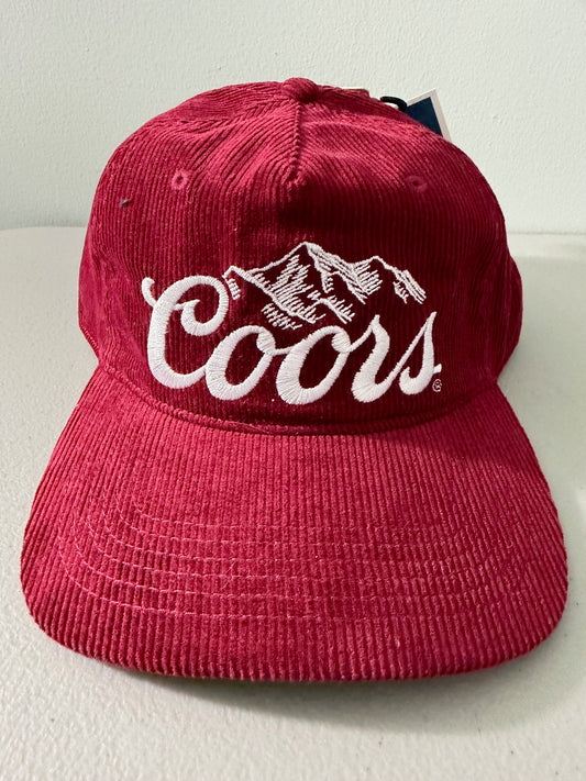Brand new Coors Banquet Beer corduroy baseball hat featuring a deep maroon structured corduroy crown and brim, white embroidered classic script logo on the front panel, and an adjustable snapback closure from Bell's Bargain Barn. 