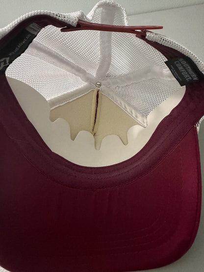 Inside View: Brand new Southern Comfort Take It Easy mesh trucker hat featuring a structured maroon front foam panel, raised gold cursive lettering, white mesh back panels, a patterned front visor accent rope, and an adjustable snapback closre from Bell's Bargain Barn. 