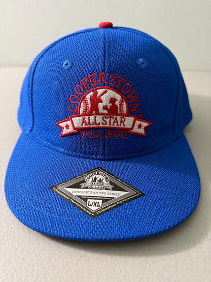 Brand new royal blue Cooperstown All Star Pro Village Pro Series stretch fit baseball hat featuring an embroidered red and white tournament patch, a diamond-shaped L/XL silver visor sticker, and an athletic mesh-textured crown from Bell's Bargain Barn. 