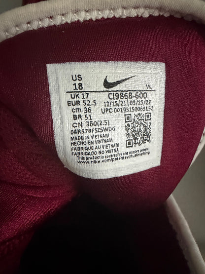 Close-up of Nike football cleat size tag and QR code for model C19868-600 in US Men's Size 