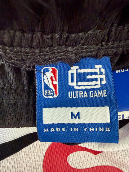 Close-up of the official Ultra Game NBA brand fabric tag showing the size 