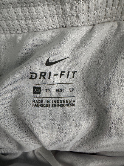 Clear view of the interior printed size label showing 'XS' and made in Indonesia.