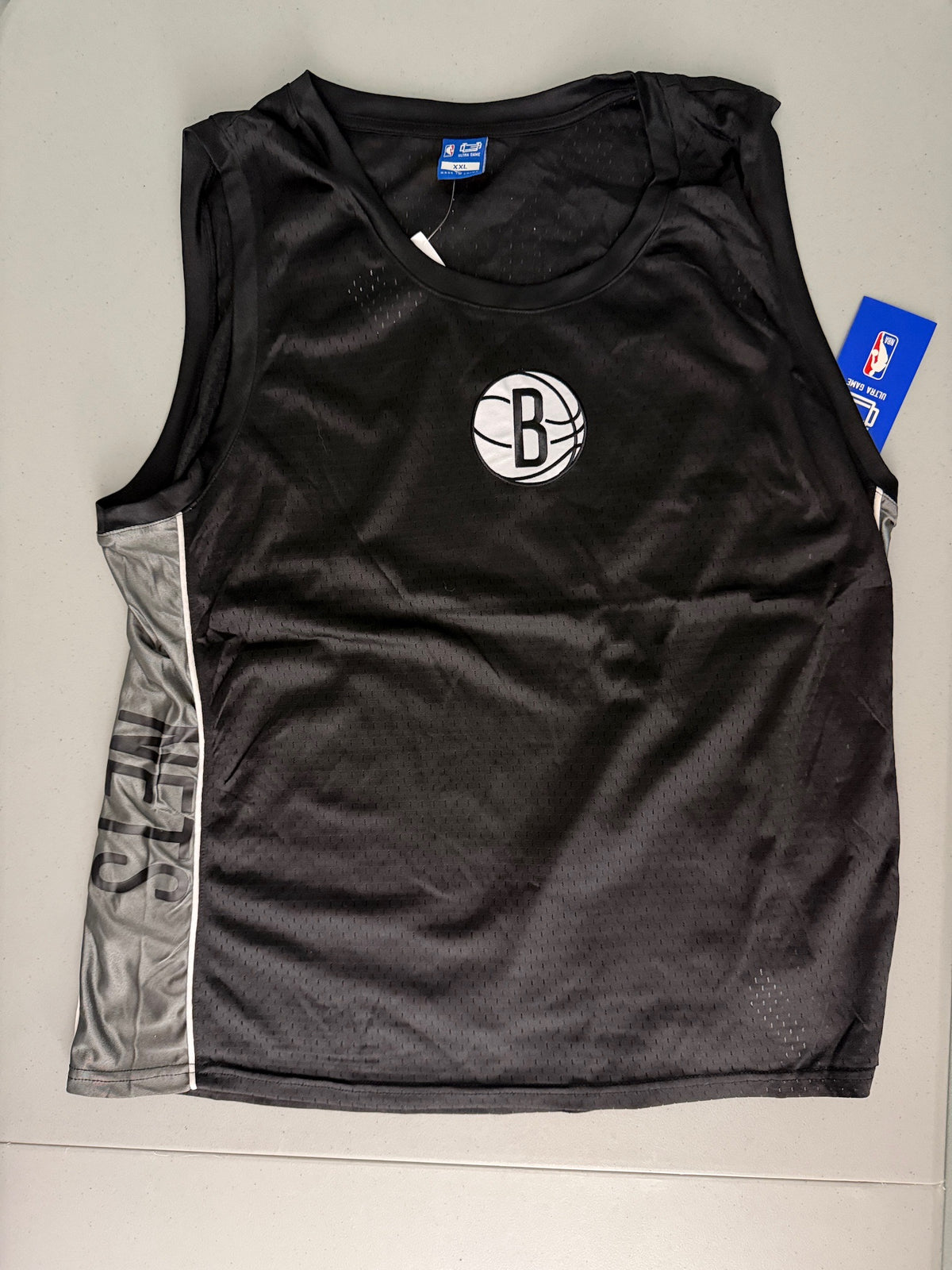 Front view of a brand new men's Ultra Game NBA Brooklyn Nets mesh basketball tank top jersey, size XXL