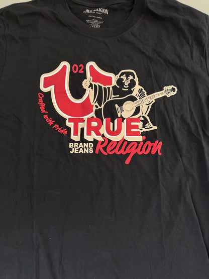 Detailed close-up of the red and white front chest graphic on the True Religion Big Horshoe Buddha T-shirt, featuring the signature oversized horseshoe and guitar-playing Buddha logo.