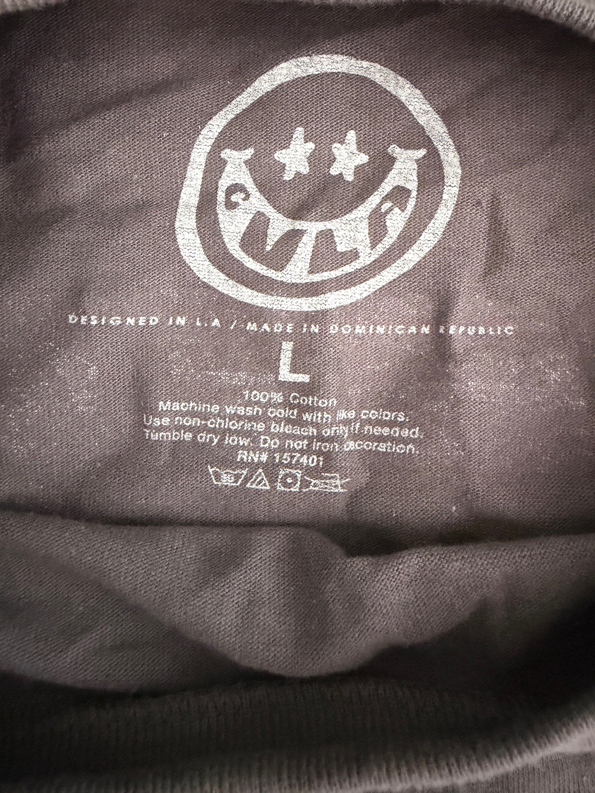 Printed neck label inside CVLA Nightfall NRX shirt showing brand name, size L. 100% cotton, and fabric care instructions.