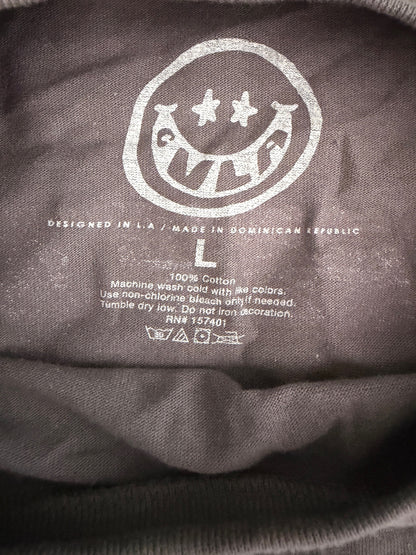 Printed neck label inside CVLA Nightfall NRX shirt showing brand name, size L. 100% cotton, and fabric care instructions.