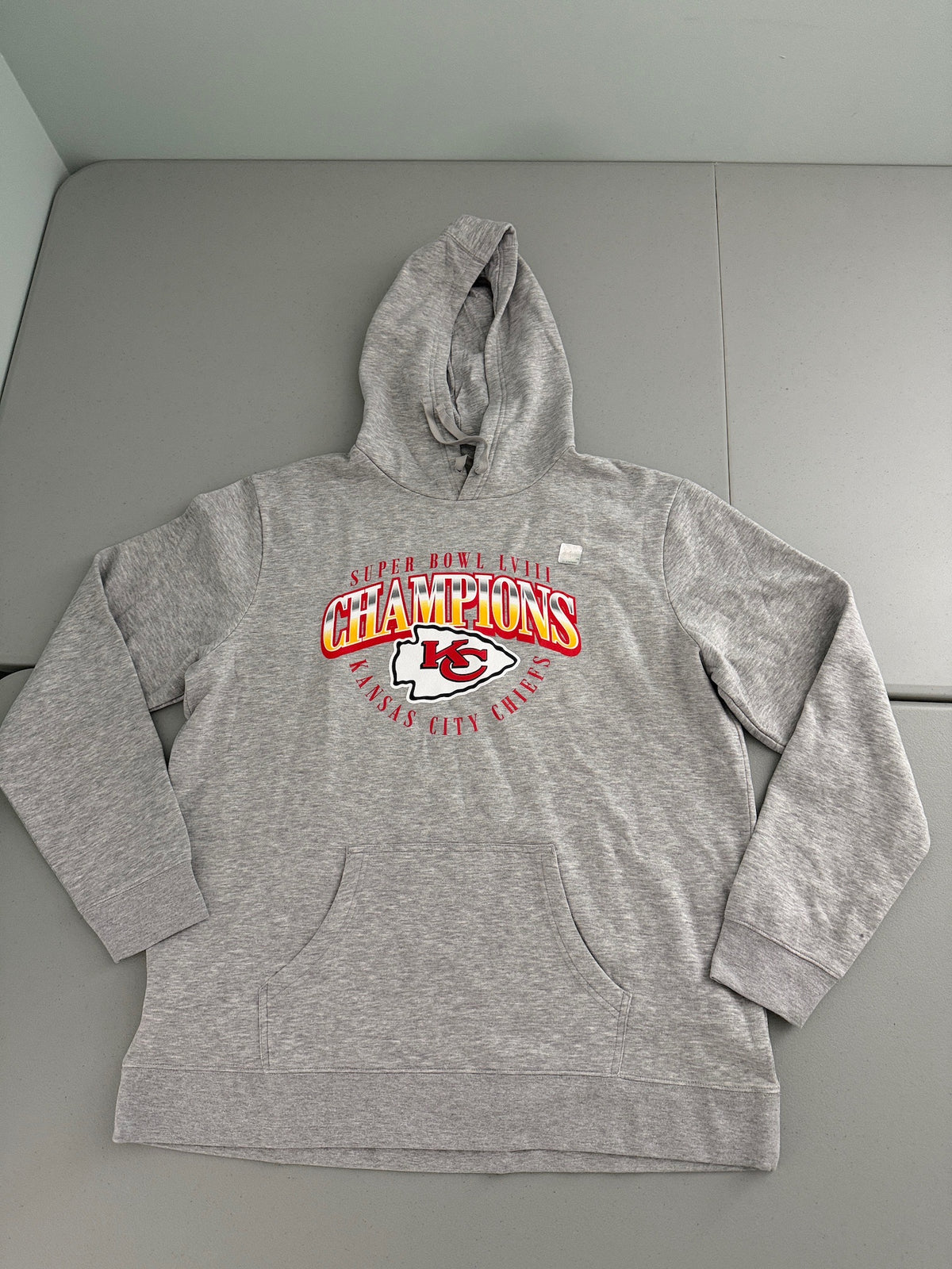 Brand new gray Men's Kansas City Chiefs Super Bowl LVIII Champions pullover hoodie sweatshirt with front kangaroo pockets