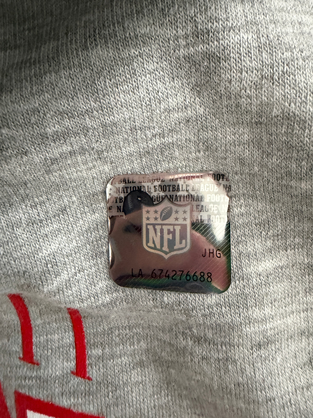 official NFL Stickers on a Brand new gray Men's Kansas City Chiefs Super Bowl LVIII Champions pullover hoodie sweatshirt. 