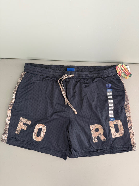 Flat lay front view of officially licensed Ford  by RoadTrip men's size XXL athletic mesh shorts navy blue with brown camouflage side panels and integrated camo Ford lettering. 