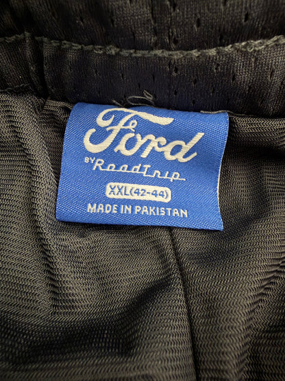 Close-up of the brand clothing label inside the Ford navy and brown camo athletic shorts showing the official licensed product branding and RoadTrip manufacturer tag.
