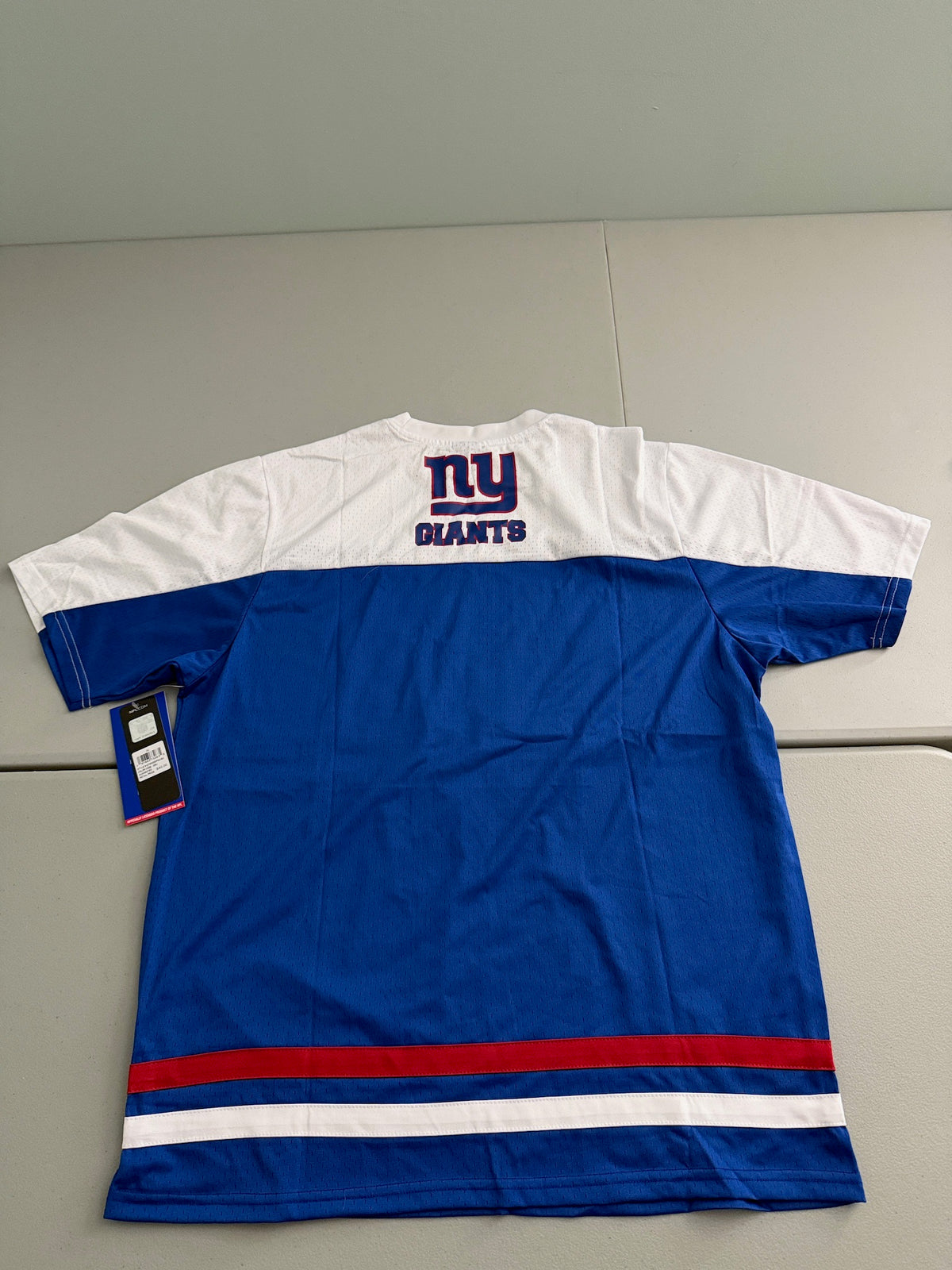 Back view of the royal blue Ultra Game Day New York Giants men's athletic t-shirt, showing the clean fabric layout across the back panel, detailed contrast stitching along the shoulders, and a comfortable flat crew neck collar profile.